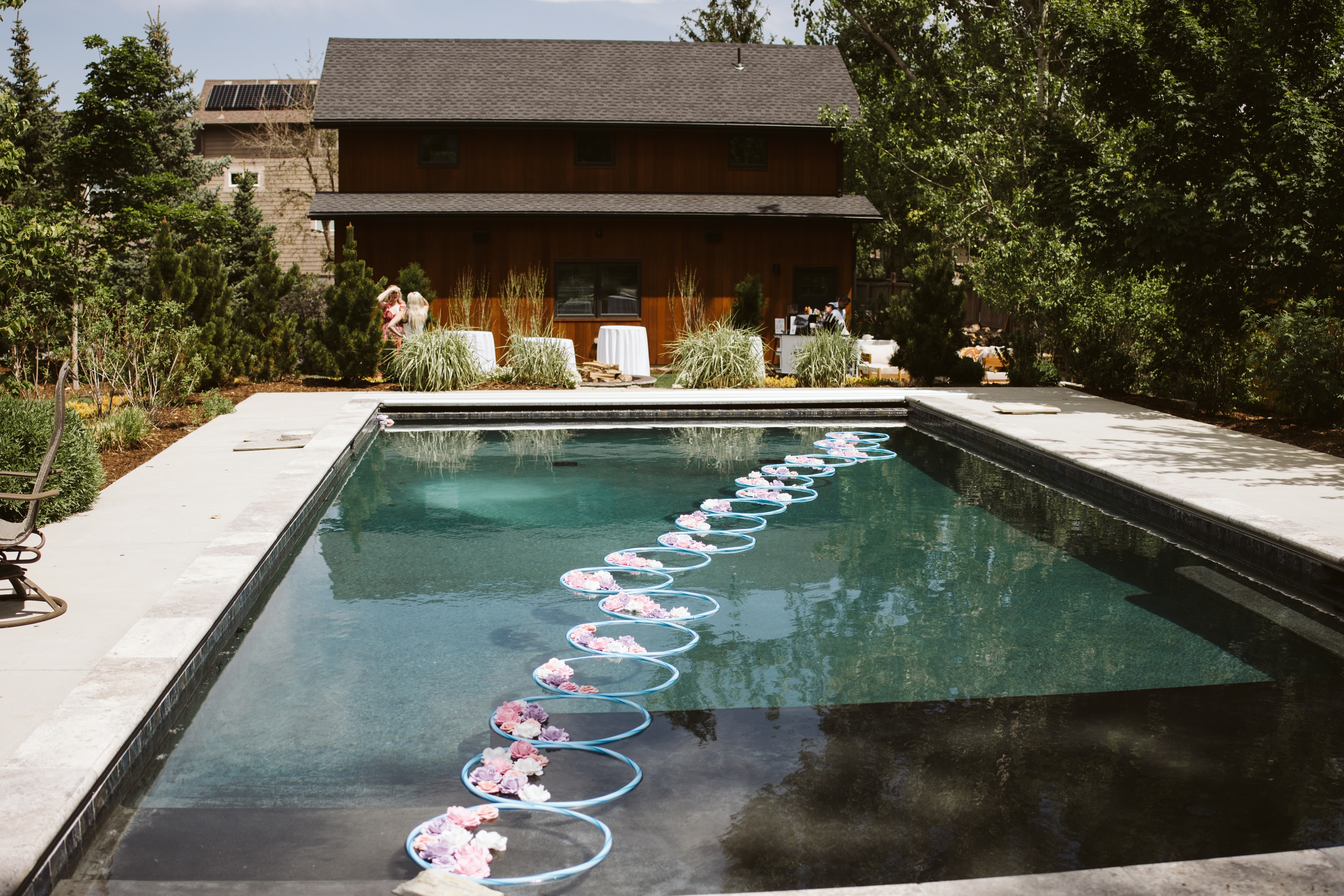The pool at Mila's Garden adorned with floating floral hoops